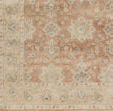 Close-up of the hand-knotted Springerville Area Carpet. Farmhouse style rug with floral pattern in terracotta, beige, and blue hues. Swatch
