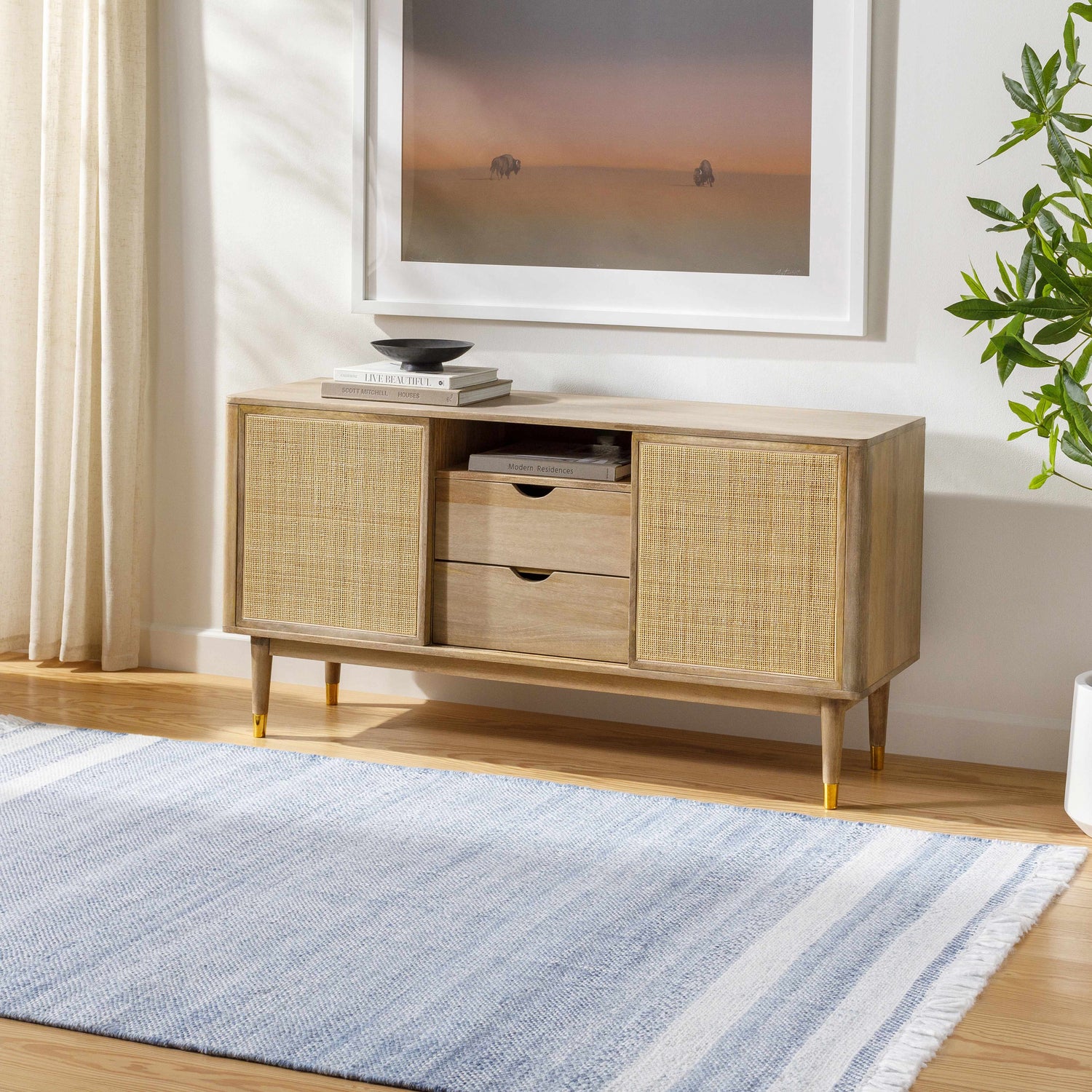 Living room scene with a Loic Silver Blue Area Rug, light wood console table, and neutral decor. Roomscene-Rectangle