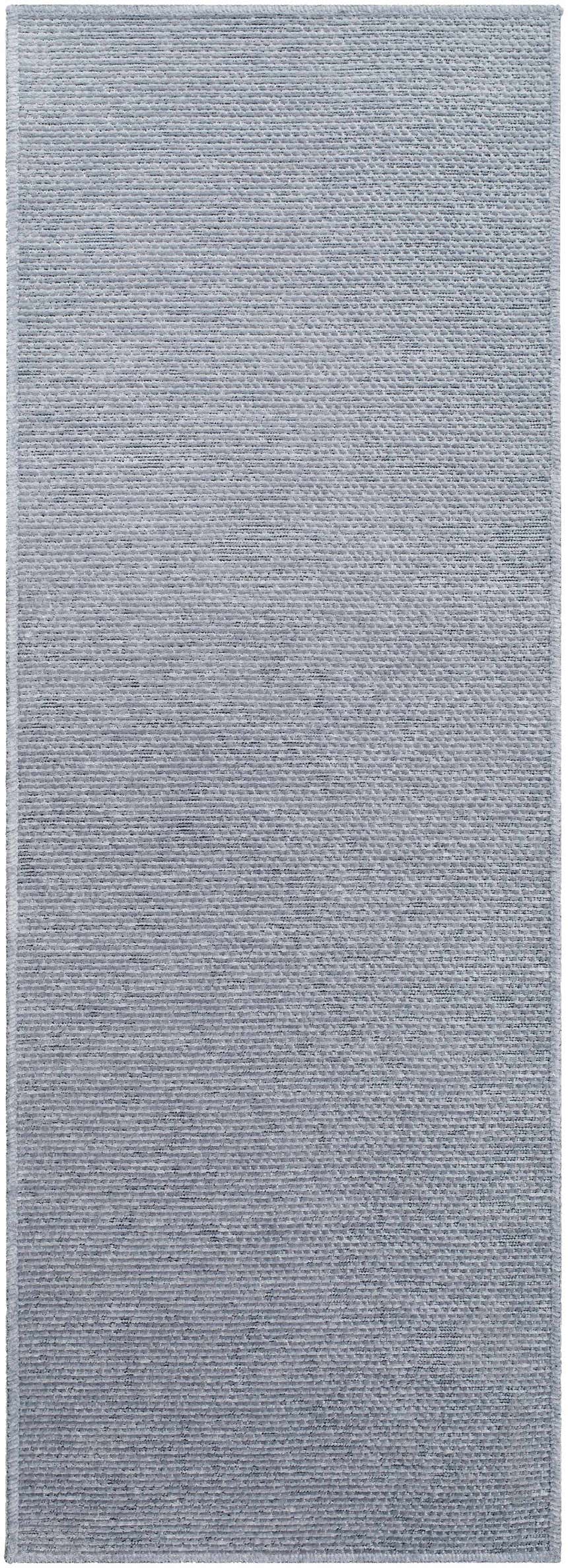 Close-up of the Isako Blue & Gray Solid Washable Area Rug, showing the light gray color and woven texture. Design-Runner-2773