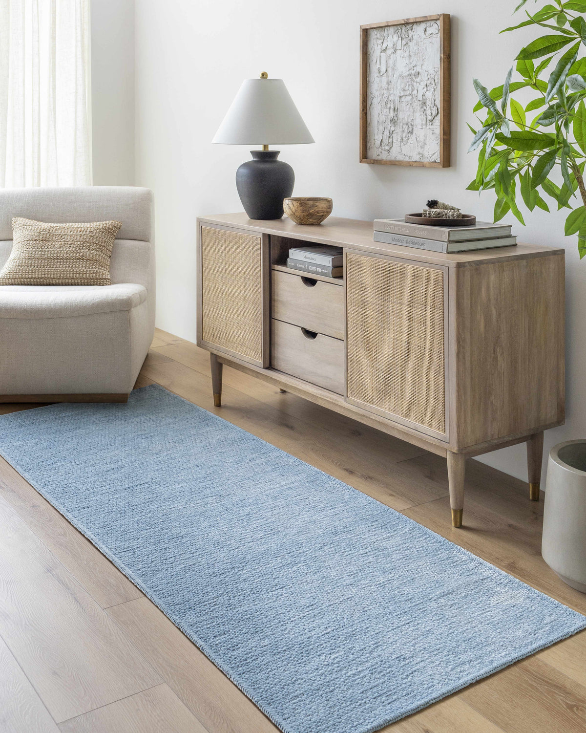 Entryway with light wood floors, a console table, and the Isako Blue Solid Washable Area Rug runner. Roomscene-Runner