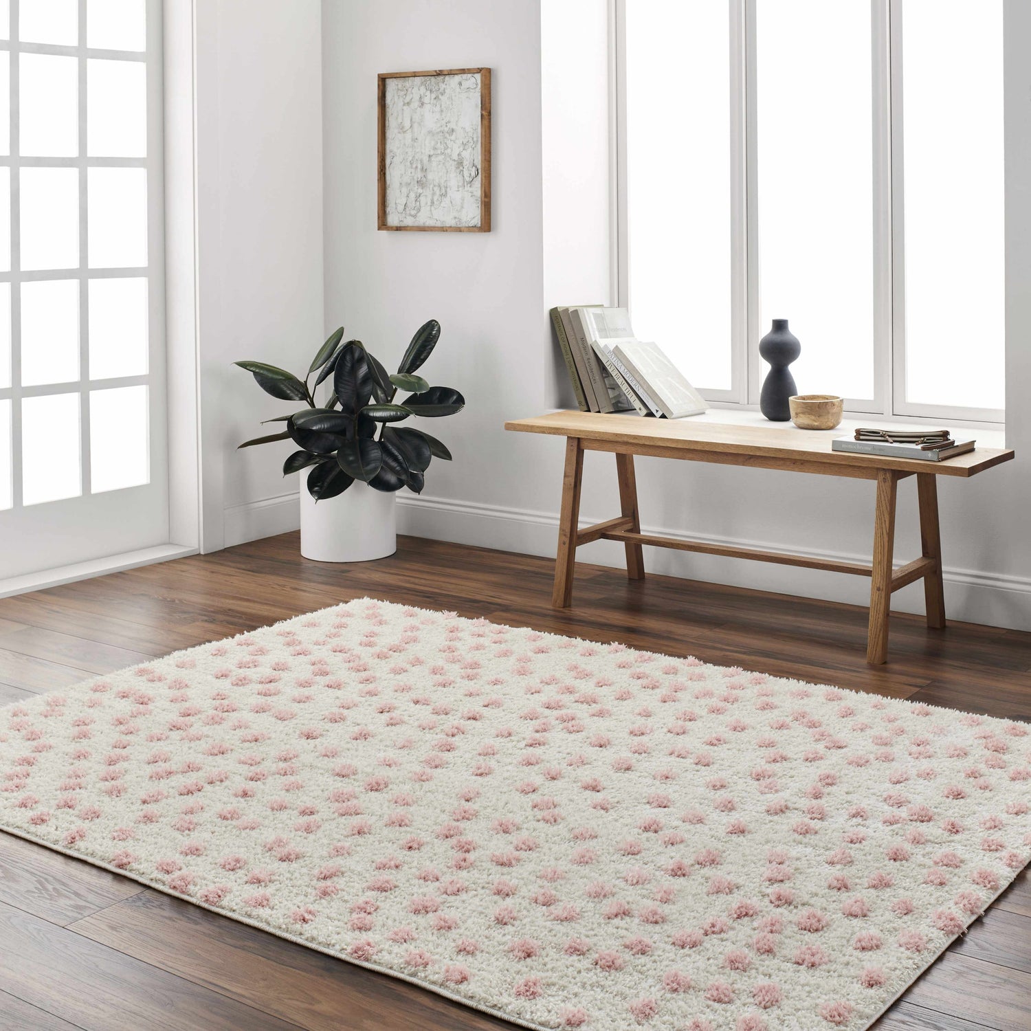 Bright room scene with a Bernt Beige Area Rug featuring pale pink dots on hardwood floors. Roomscene-Rectangle