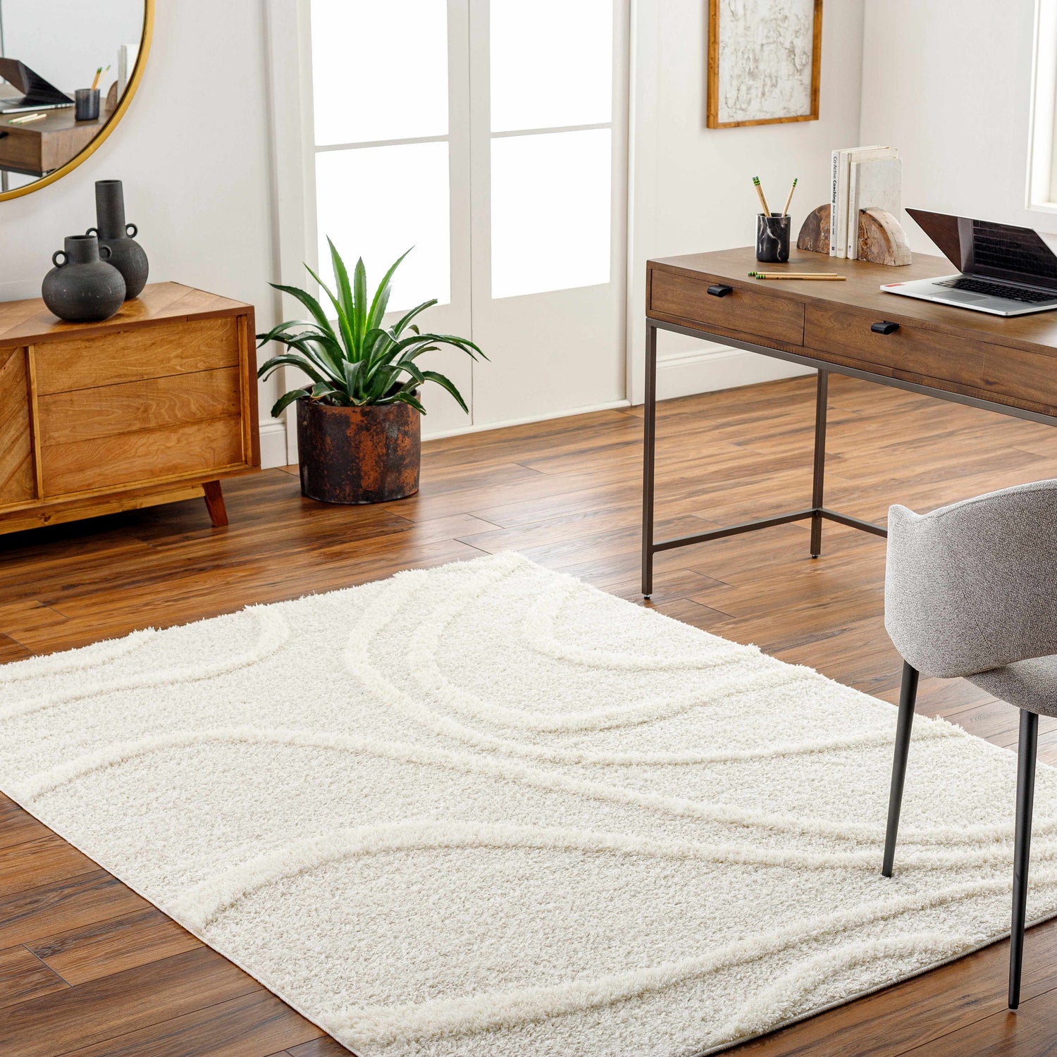 Home office with wood desk and Horst Off White Area Rug. Neutral tones create a calm, contemporary workspace. Roomscene-Rectangle
