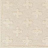 Close-up of the Satu Cream Area Rug. Shag rug with geometric pattern in bone, driftwood, gray, and nutmeg hues. Soft texture. Swatch