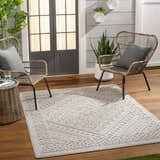 Patio scene with Hibah Natural Gray Area Rug, wicker chairs, wood floors, and gray accents. Roomscene-Rectangle