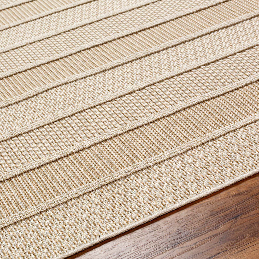 Close-up of the beige and bone Idana Area Rug showing its textured, contemporary, striped design and machine-woven construction. Texture