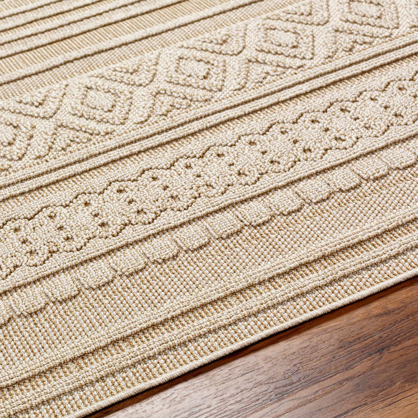Close-up of the Kojo Lambswool Area Rug showing its textured, contemporary design in camel and light brown tones. Texture