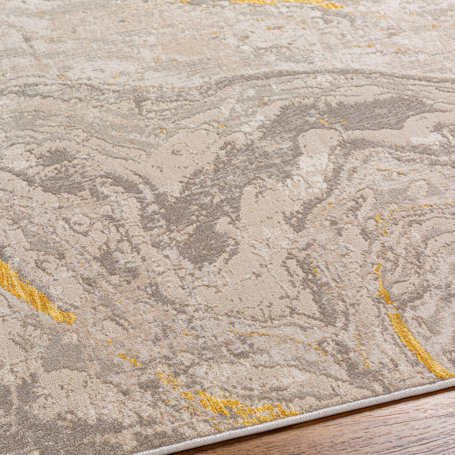 Close-up of the Akins Beige Marble Rug, showcasing its contemporary design, beige, gray, and subtle mustard tones. Texture