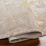 Close-up of Bella Area Rug in Beachhouse colorway showing abstract pattern and texture. Fold