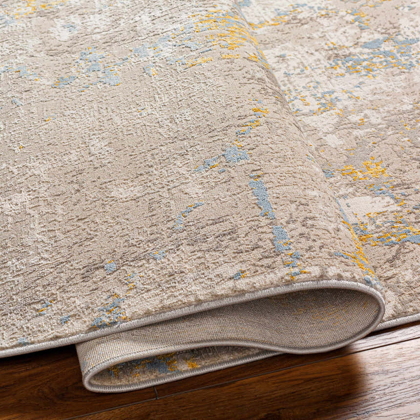 Close-up of Bella Area Rug in Beachhouse colorway showing abstract pattern and texture. Fold