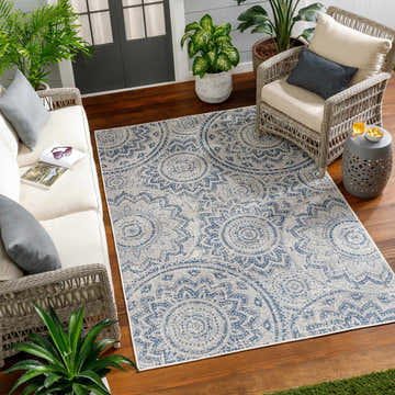 Outdoor living room with wicker furniture and the Ayala Blue Durable Rug. Roomscene-Rectangle