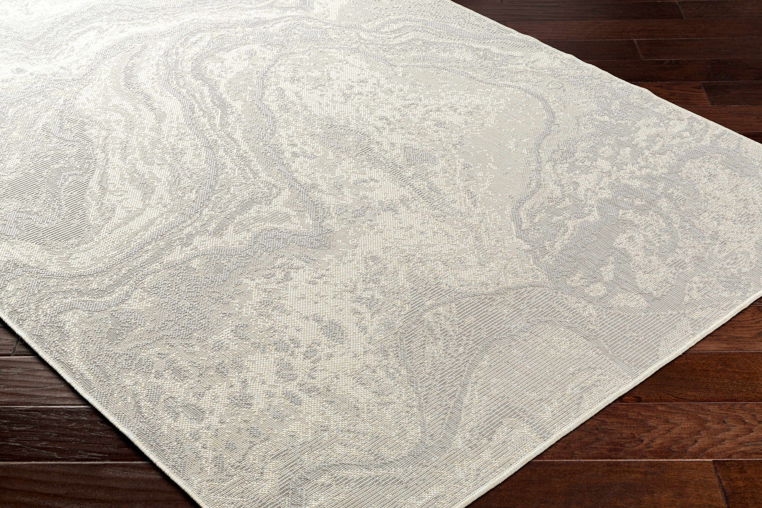 Close up of the Basma Cream Marble Area Rug showing the bone and gray marble pattern. Corner