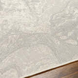 Close-up of the Basma Cream Marble Area Rug showing its beige, bone, and gray contemporary pattern and machine-woven texture. Texture