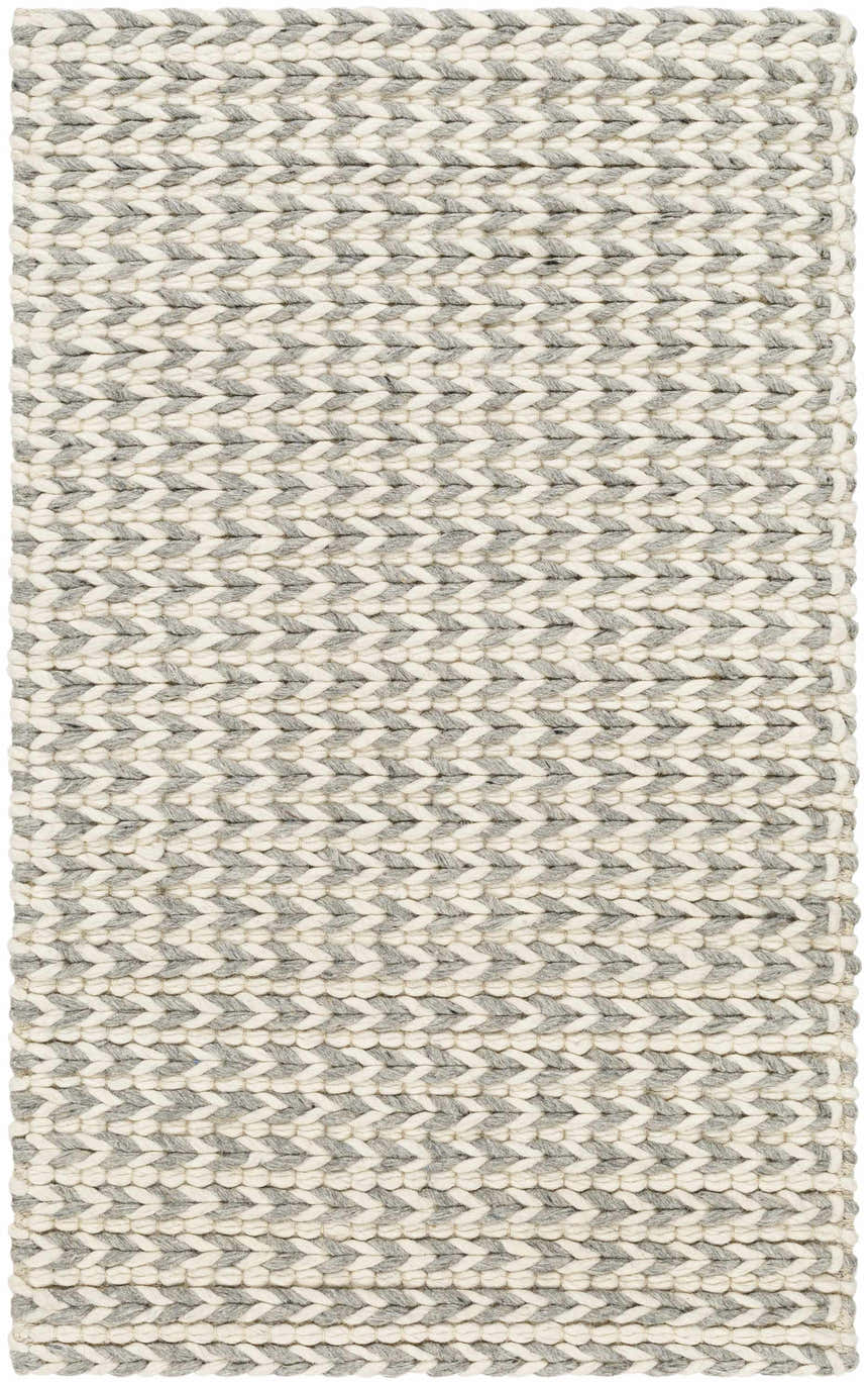 Close-up of a hand-woven Lenci Bone Area Rug. Beige and bone braided wool and cotton create a textured, contemporary design. Design-Rectangle-23