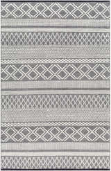 Close-up of the Hala Area Rug. Hand-woven wool rug in dark gray, nickel, off white, and taupe with geometric patterns. Design-Rectangle-576