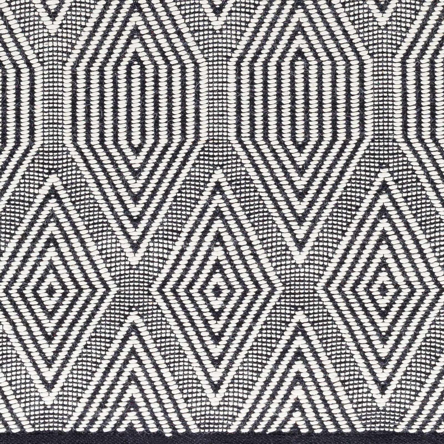 Close-up of the Naya Area Rug showing a geometric diamond pattern in dark gray, silverton, and smoke. Hand woven texture. Swatch