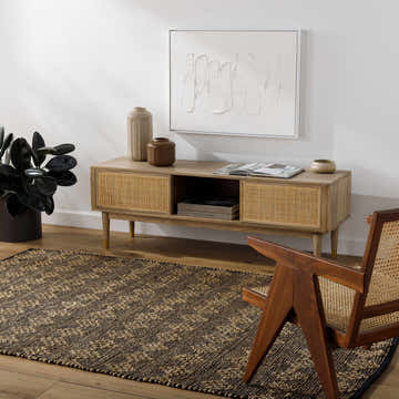 Living room scene with a brown Irina Area Rug, wood console table, chair, and neutral decor. Roomscene-Rectangle