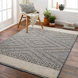 Living room scene with geometric Blue Areli Area Rug, wood floors, chair, and window. Contemporary style. Roomscene-Rectangle