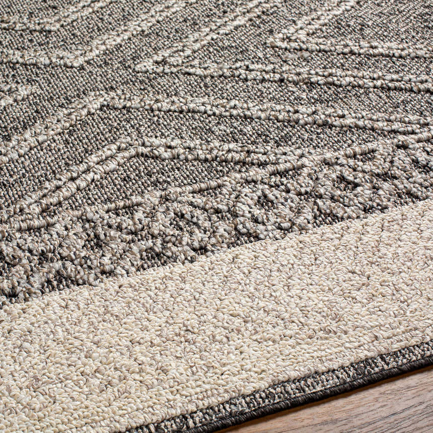 Close-up of the Areli Beige / Brown Outdoor Rug showing the contemporary pattern and textured weave. Texture
