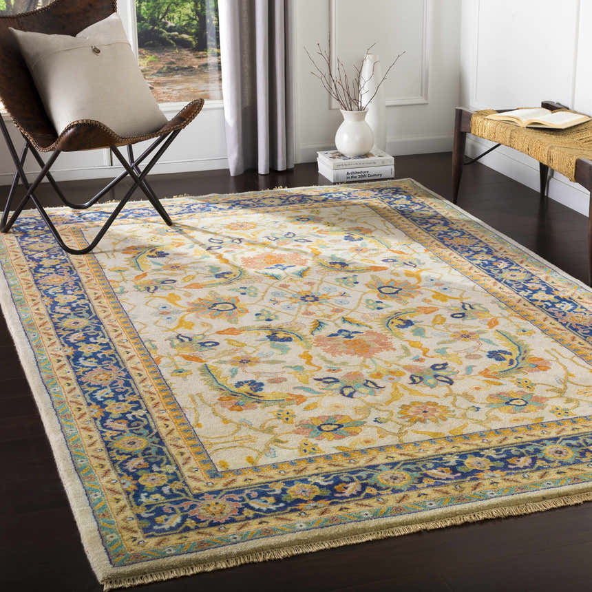 Living room scene with a Starford Carpet. Farmhouse style with floral pattern in blue, yellow, and peach tones. Roomscene-Rectangle