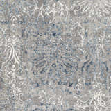 Close-up of the Statham Area Rug showing its charcoal, denim, and ivory traditional floral pattern. Swatch