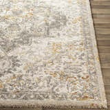 Close-up of the Stockwell Thick Luxe Rug. Features a distressed, vintage-inspired pattern in ivory, gold, and gray. Front