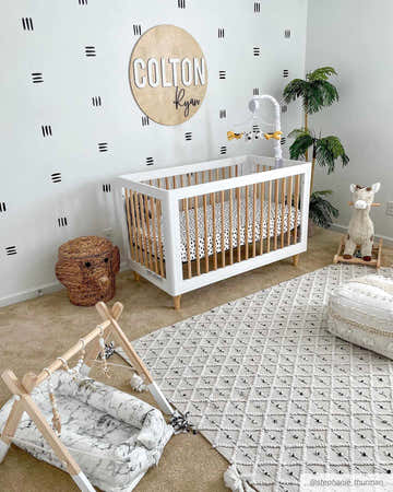 Nursery with white crib and the black and ivory Sadleir Indoor Outdoor Rug. Bohemian style kids room. Roomscene-Rectangle