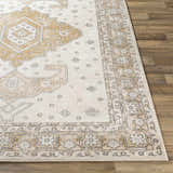 Close-up of the beige and off-white Southwark Area Rug showing its traditional, geometric, floral pattern and machine-woven texture. Front