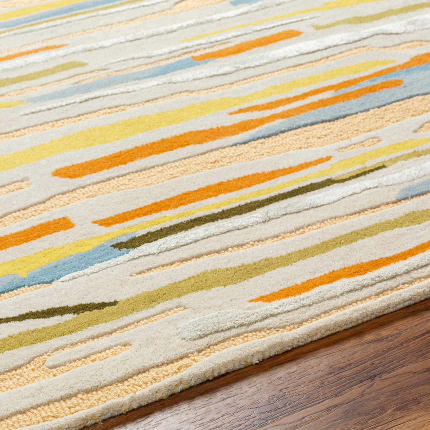 Close-up of the Aram Area Rug showing its bronze, camel, and orange striped contemporary design and hand-tufted wool texture. Texture