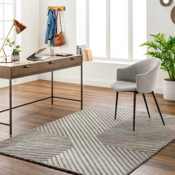 Home office with wood desk, gray chair, and beige Juan Area Rug with geometric pattern. Roomscene-Rectangle