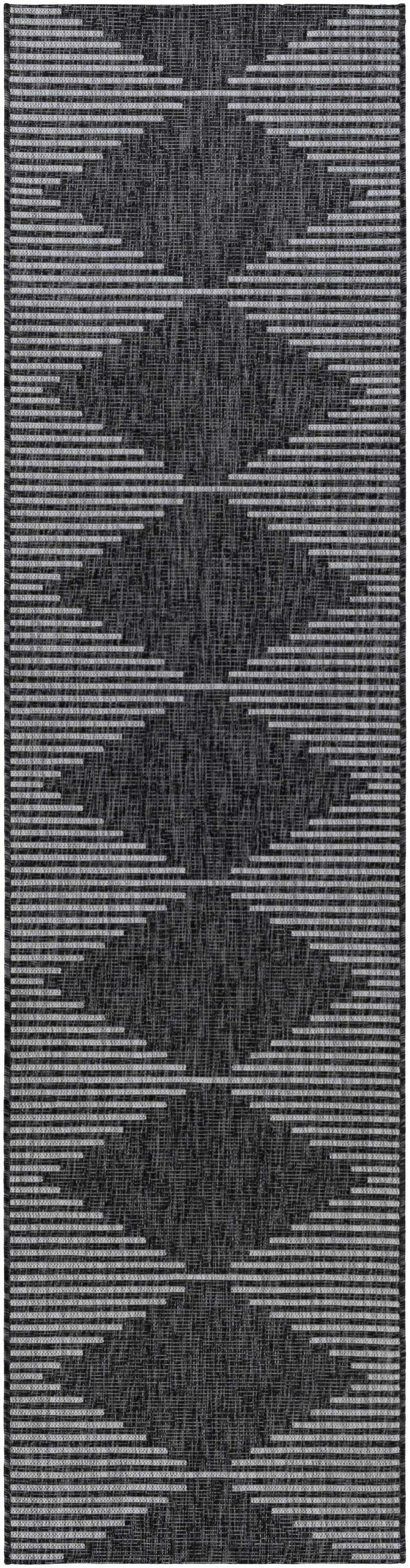 Close-up of the Stephan Area Rug, featuring a black and light gray geometric Southwestern-style pattern. Design-Runner-2710