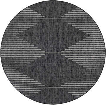 Close-up of round Stephan Area Rug with a black and cream Southwestern-inspired geometric pattern. Design-Round-710