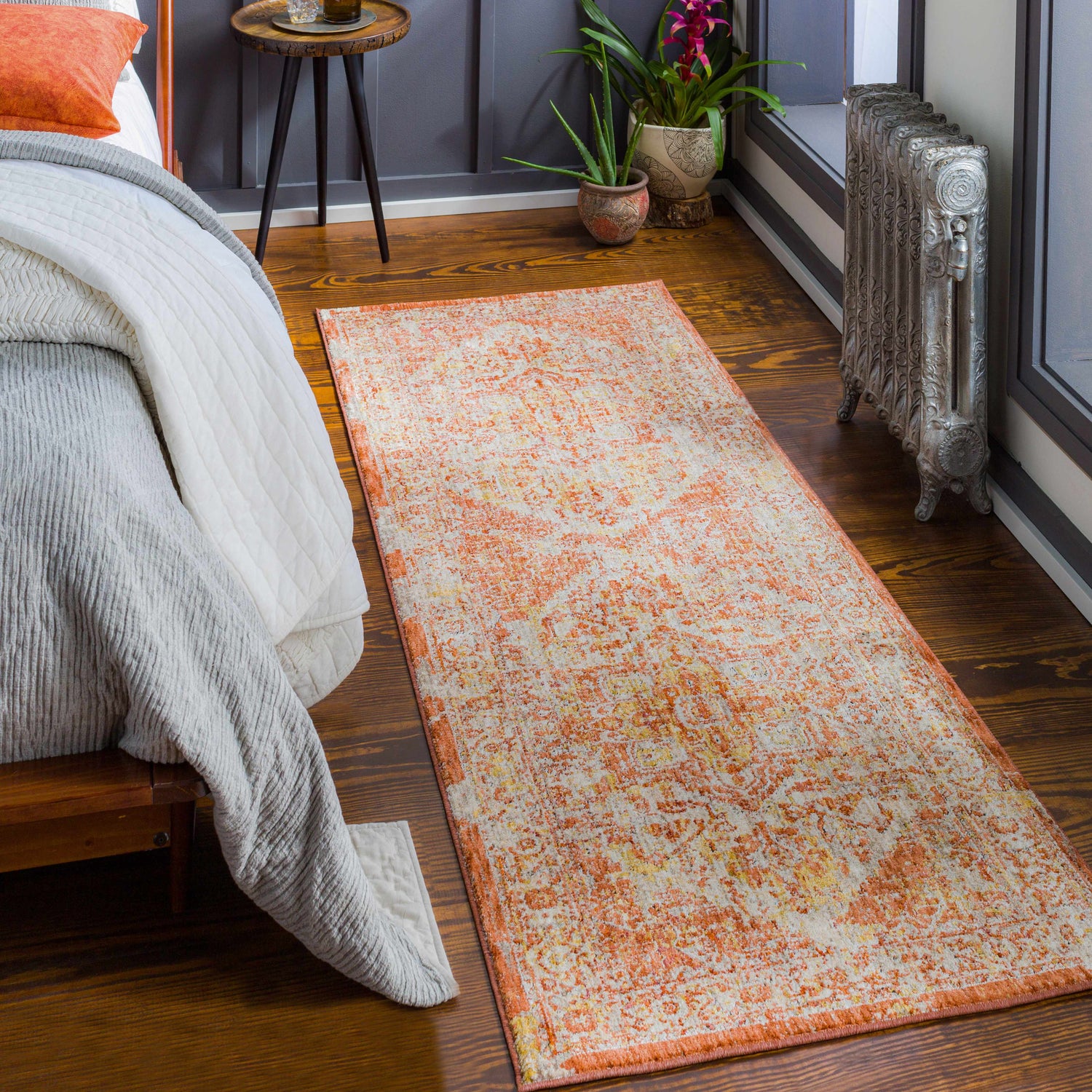 Bedroom scene with Strathbogie Traditional Red Area Rug. Rug has brick red, cream, and mustard colors. Bohemian style. Roomscene-Runner