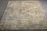 Close-up of the Streatley Area Rug. Beige, black, gray, and mustard tones with a textured, contemporary design. Styleshot