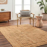 Living room scene with a tan Tino Area Rug, wood furniture, and a neutral color palette. Roomscene-Rectangle