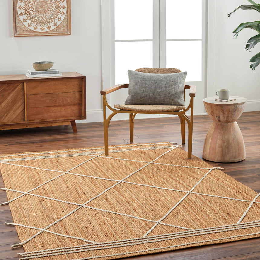 Living room scene with a Wasi Area Rug, caramel jute with a geometric pattern, chair, wood cabinet, and side table. Roomscene-Rectangle