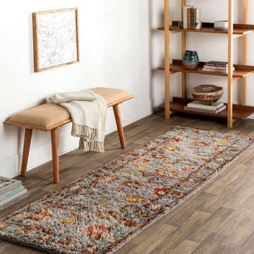Entryway scene with Suisun Premium Rug runner, wood bench, and bookshelf. Bohemian style with brick red, cream, and gray tones. Roomscene-Runner