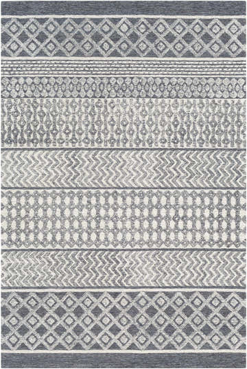 Close-up of the hand-tufted Sullivan Area Rug. Bohemian style with geometric patterns in black, charcoal, and light beige wool. Design-Rectangle-576