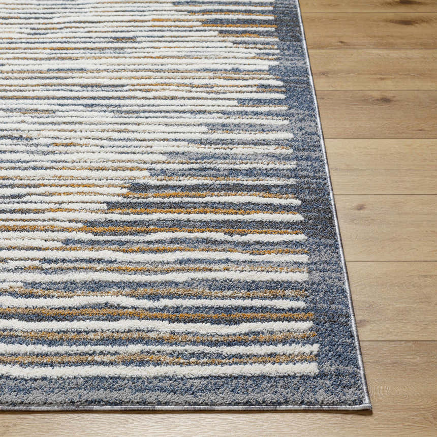Close-up of the Kylar Area Rug showing its gray, smoke, white, and gold horizontal stripe pattern and soft texture. Front