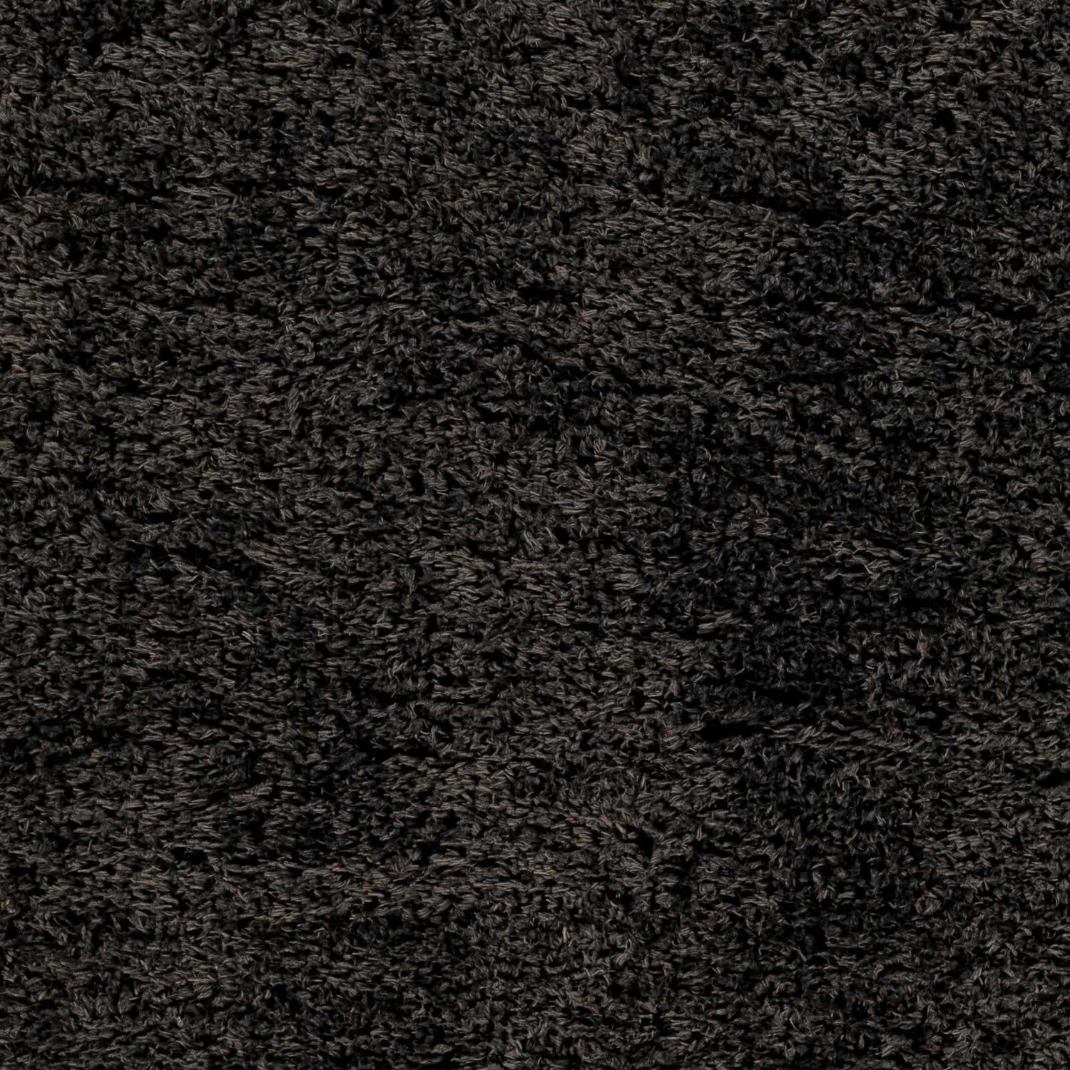 Close-up of the Black Allon Area Rug showing its dense, soft shag texture and rich black color. Swatch