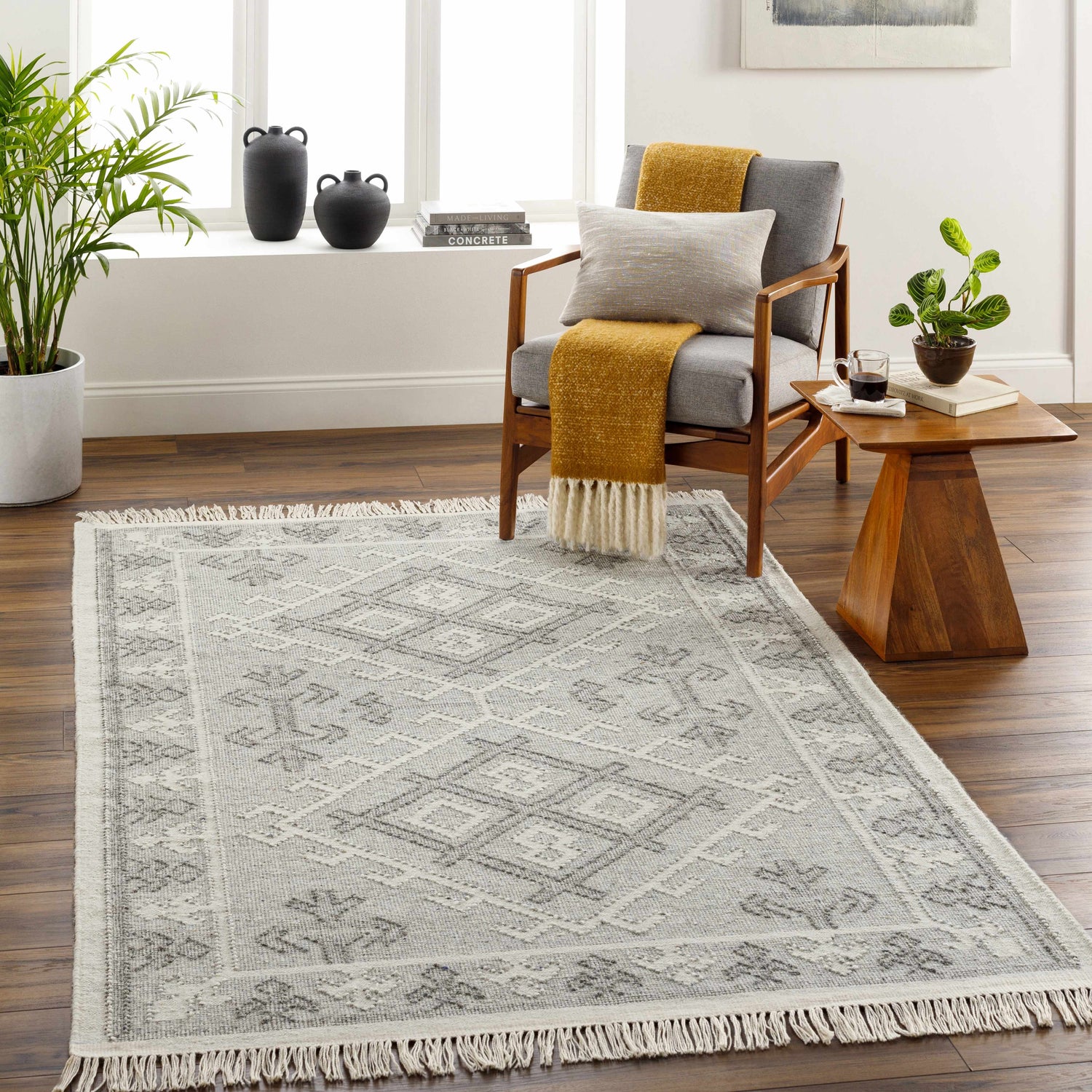 Living room scene with gray armchair and the gray and white wool Memo Area Rug. Roomscene-Rectangle