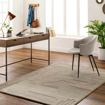 Home office with a beige Dessa Area Rug, wood desk, and gray chair. Contemporary style. Roomscene-Rectangle
