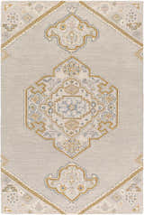 Close-up of the hand-tufted Mayu Area Rug. Beige wool rug with traditional diamond pattern and gold, gray, and blue accents. Design-Rectangle-576