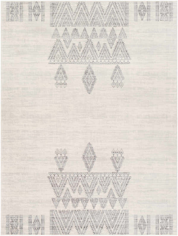 Close-up of the Wakita Light Gray Tribal Rug. Features a geometric, tribal-inspired pattern in charcoal and light gray on an off-white base. Design-Rectangle-537
