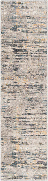 Close-up of the Sywell Luxe Fringe Rug. Beige rug with blue, charcoal and tan horizontal striations. Contemporary style. Design-Runner-2710