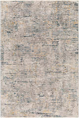 Close-up of the Sywell Luxe Fringe Rug. Beige, blue, and charcoal distressed contemporary pattern. Design-Rectangle-575