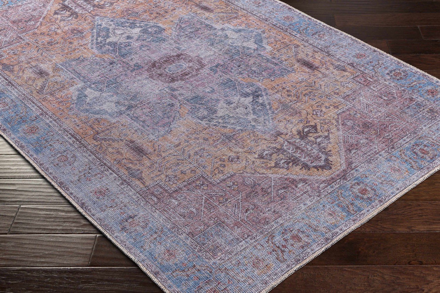 Close-up of the Otaki Purple & Brown Washable Area Rug showing its traditional oriental pattern and soft chenille texture. Corner
