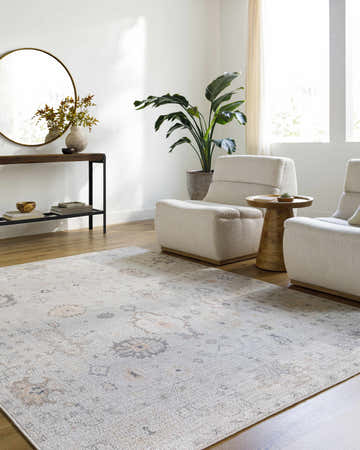 Living room with neutral armchairs and the Taryn Area Rug in dusty pink, gray, and tan. Roomscene-Rectangle
