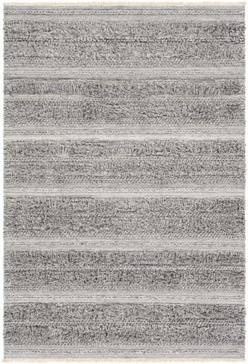 Close-up of the Teachey rug. Hand-woven shag rug in cream and gray with horizontal stripes and fringe. Bohemian style. Design-Rectangle-576