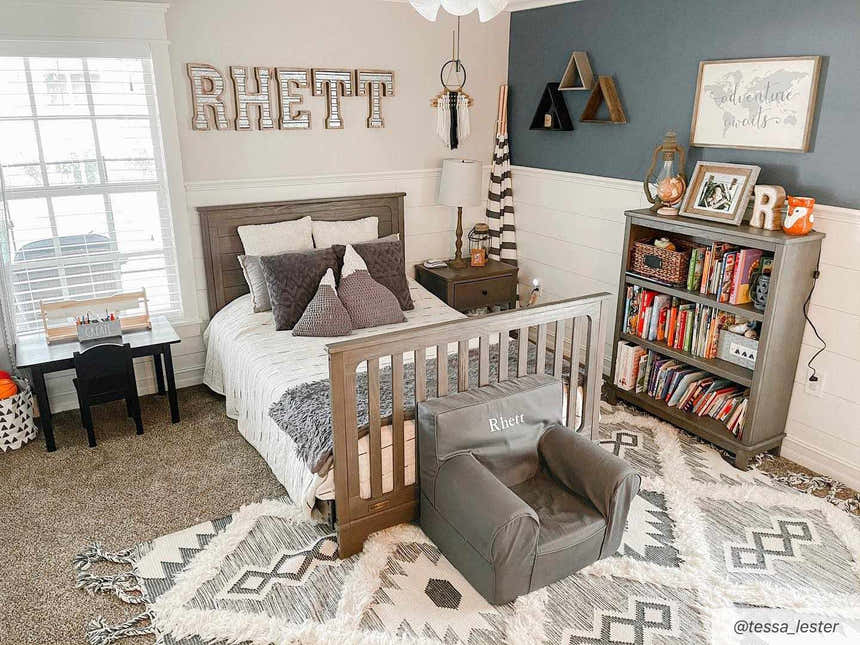 Kids room with a Jarales Cream/Black Tribal Tassel Wool Rug, gray bed, bookshelf, and chair. Bohemian style. Roomscene-Rectangle