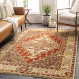 Living room scene with a rectangular Texico Area Rug in rust, brown, and beige with a traditional, hand-knotted design. Roomscene-Rectangle